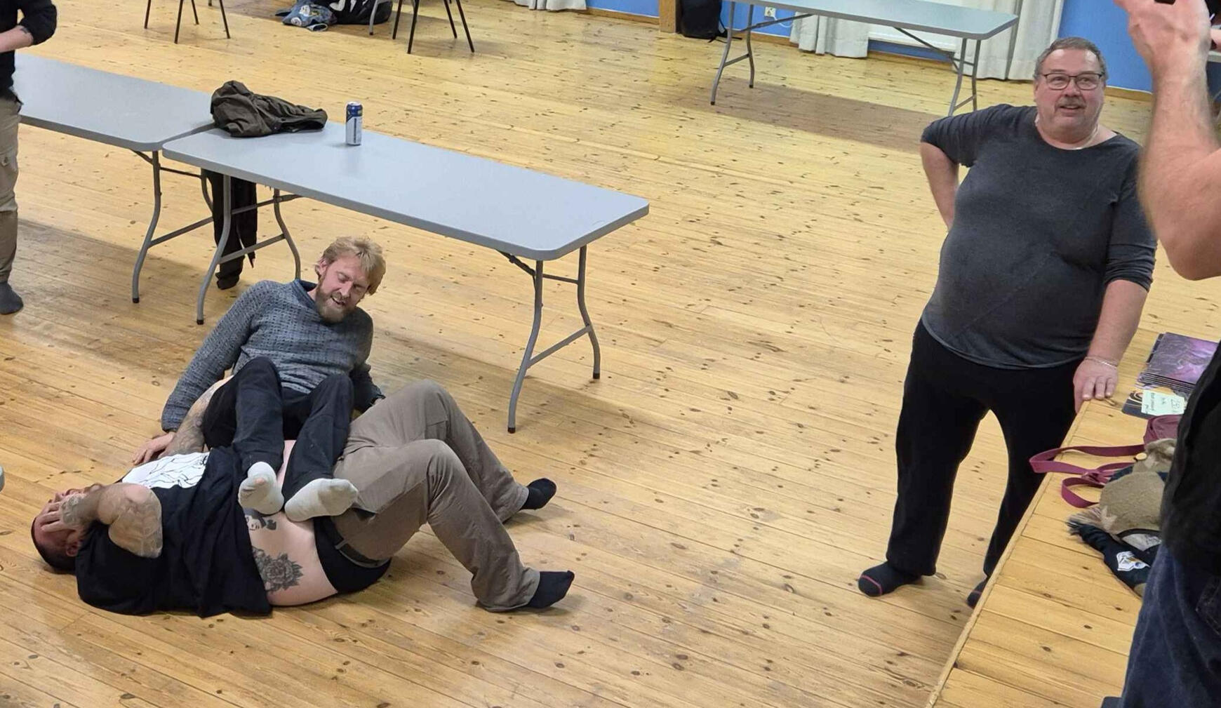 Grownups rolling on the floor